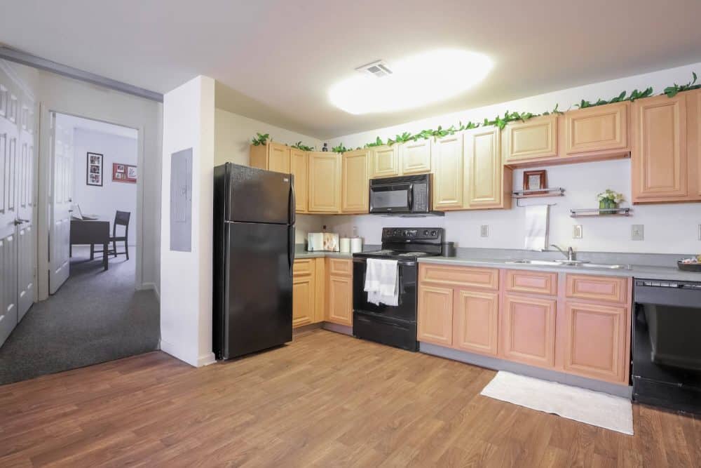 2909 oliver off campus apartments near wichita state university full kitchen faux wood flooring black appliances